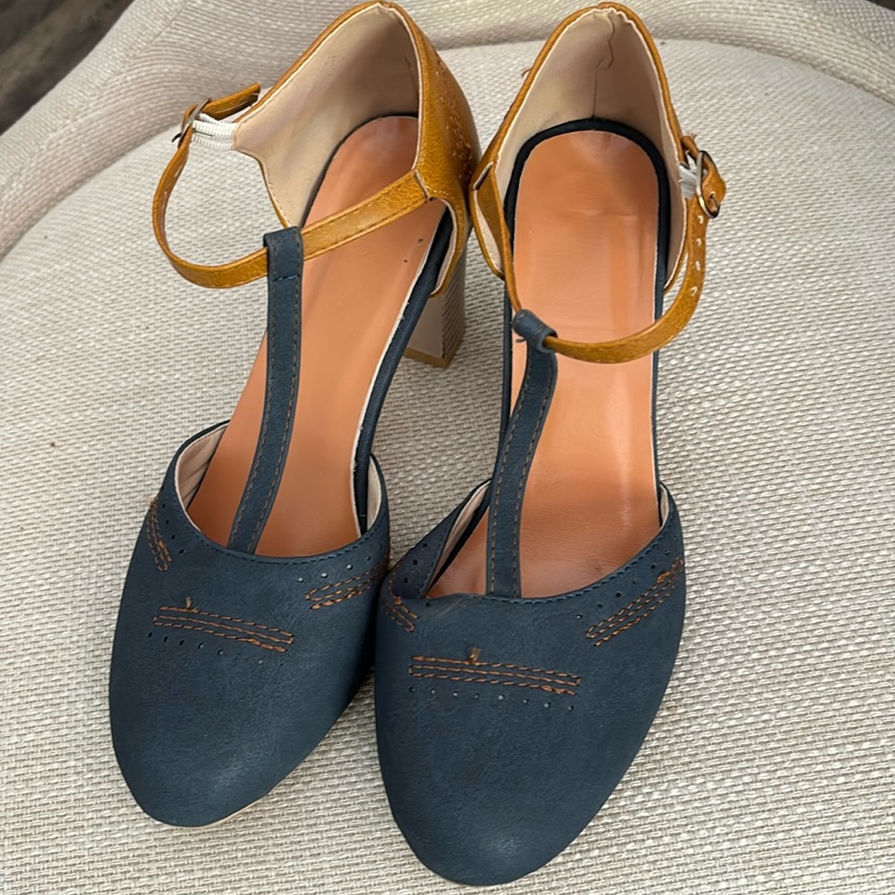 Ladies, size 4 aka size 9. Blue denim color with tan heel back, 3” heel.